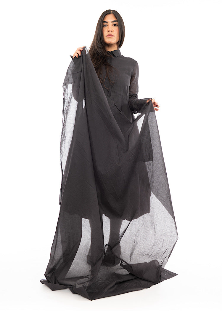 A Model holding the full length of a washed Grey Scarf. Showing the amount of material there is to desig with.