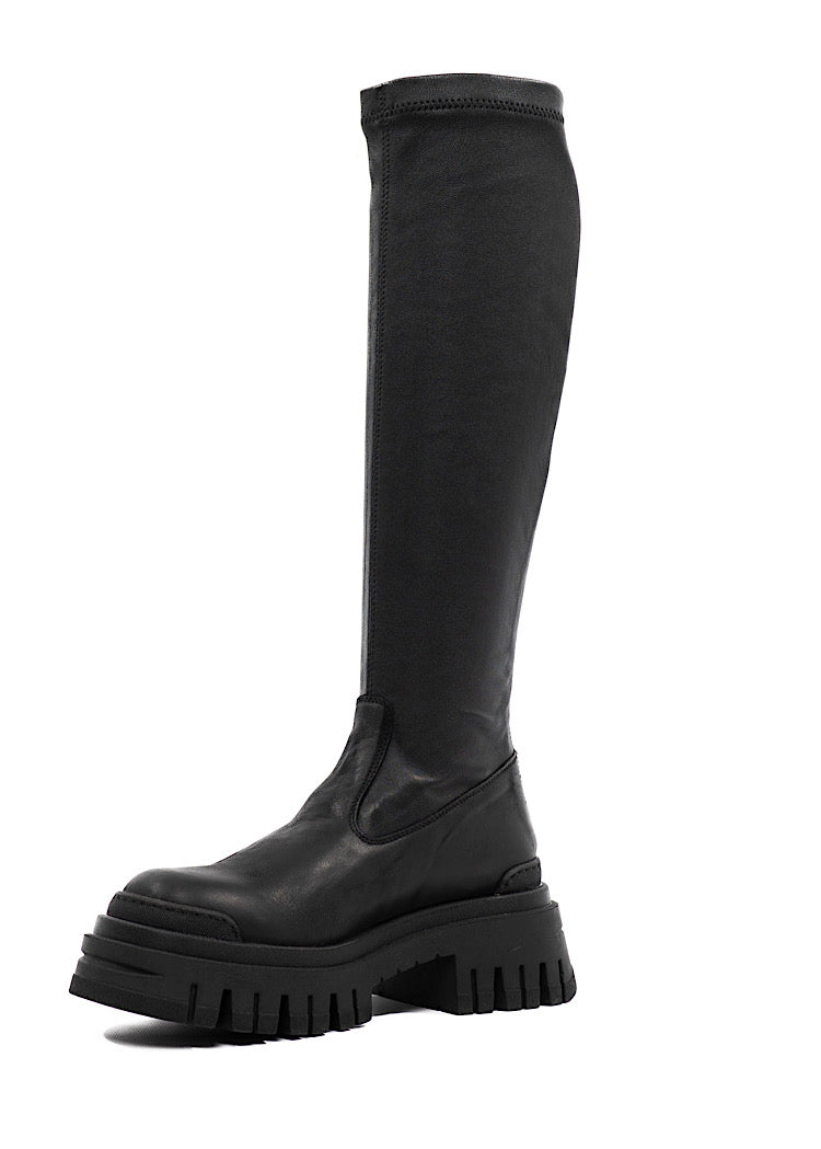 A Side profile of a long chunky Black Boot with a distinct sole.