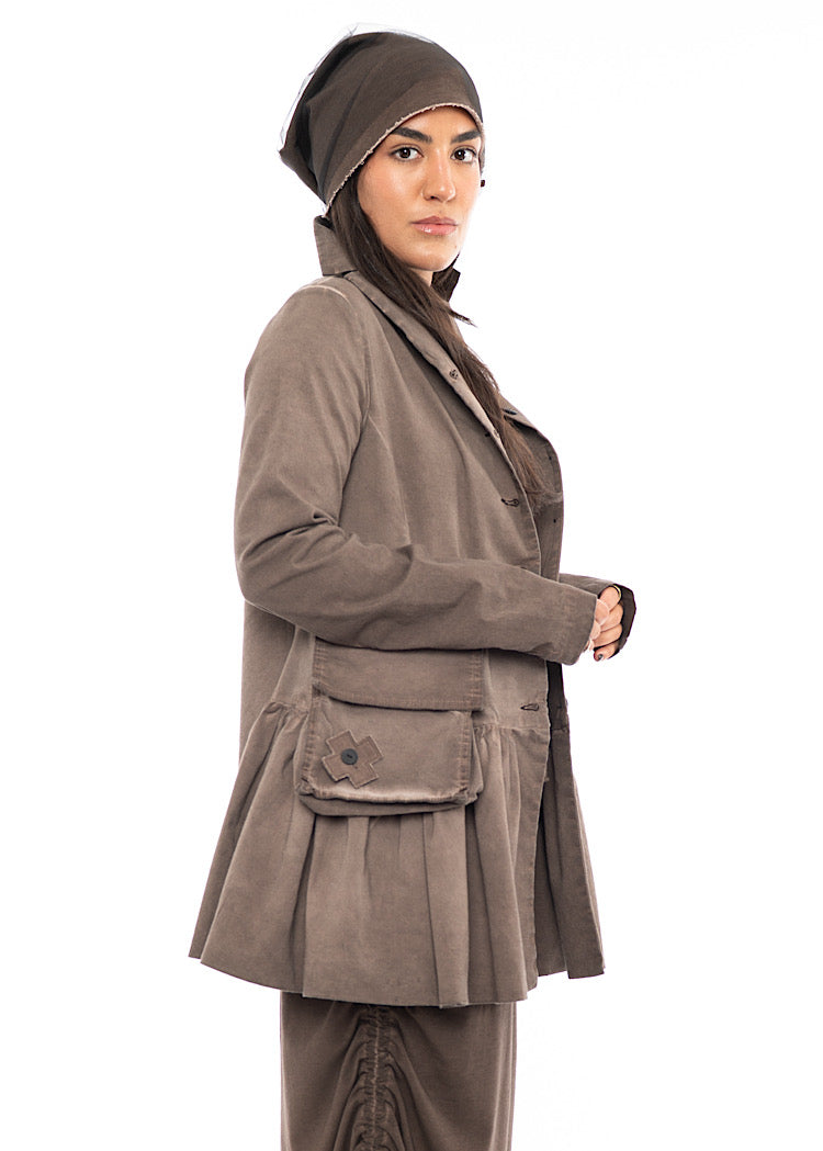 A Model wearing a matching Chocolate Brown outfit. Featuring a mesh beanie, showing the volume it creates to the look.